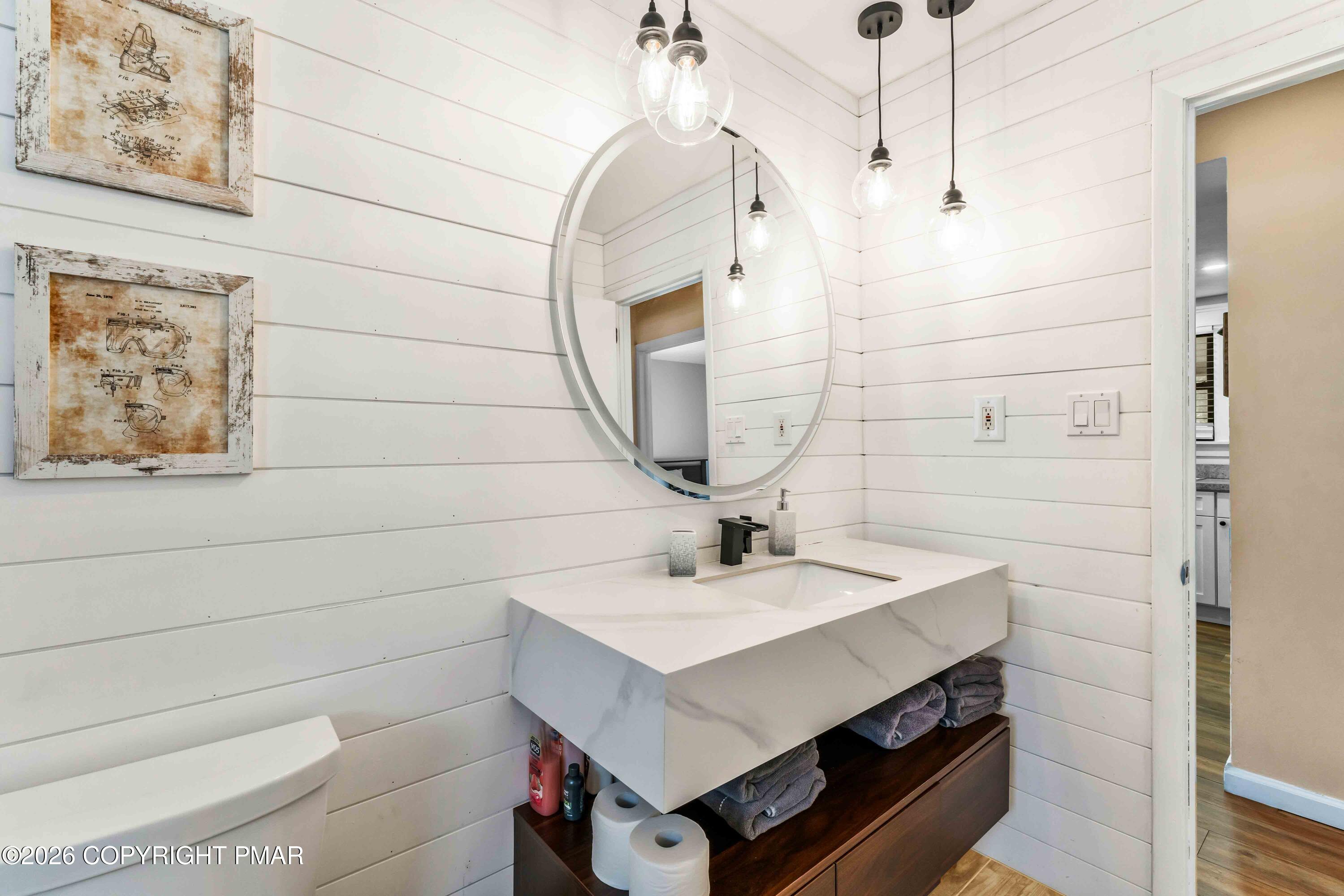 102 King Arthur Road Pocono Lake, PA 18347 - Photo 31 of 59 a bathroom with a sink a vanity and a mirror
