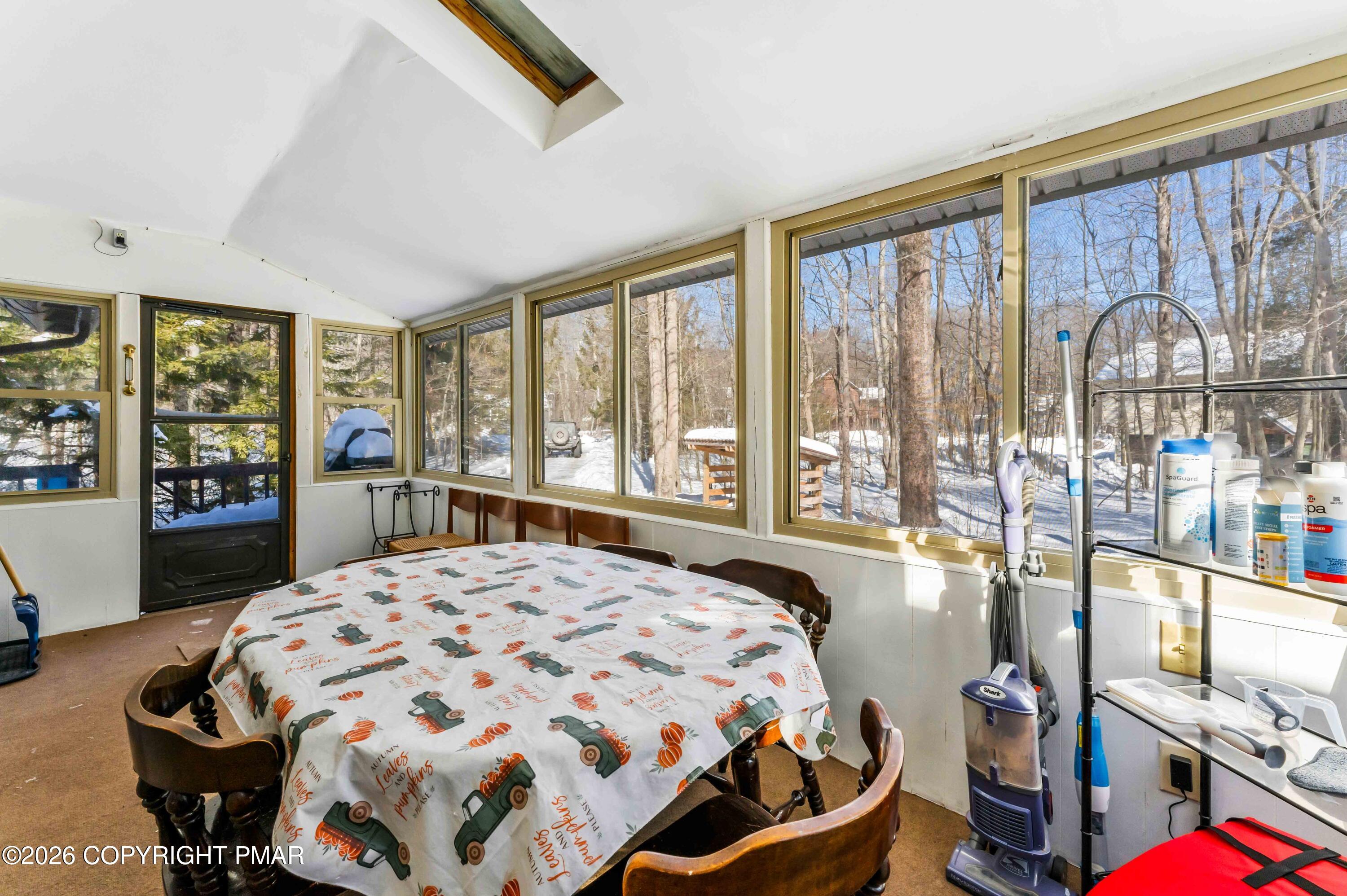 102 King Arthur Road Pocono Lake, PA 18347 - Photo 46 of 59 a bedroom with a bed and a large window with outer view