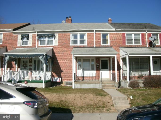 1154 Cedarcroft Road Baltimore, MD 21239 - Photo 1 of 7 a view of a house with a yard