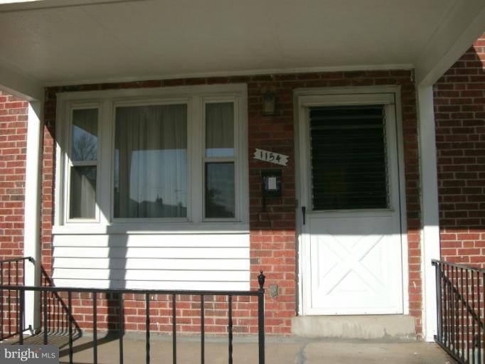 1154 Cedarcroft Road Baltimore, MD 21239 - Photo 3 of 7 a view of entrance gate of a house