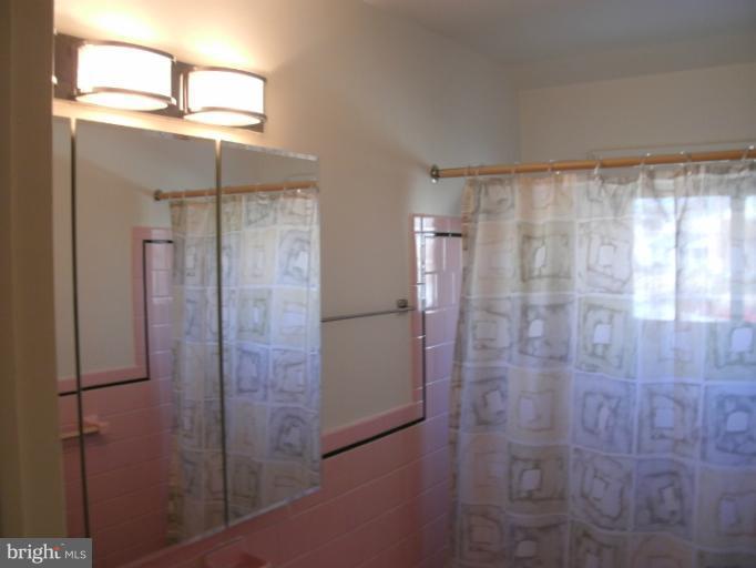 1154 Cedarcroft Road Baltimore, MD 21239 - Photo 4 of 7 a bathroom with a shower