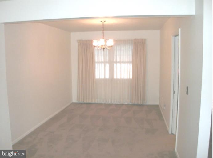 1154 Cedarcroft Road Baltimore, MD 21239 - Photo 5 of 7 a view of an empty room with a window