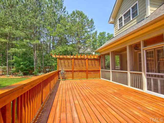 9705 Bailey Grove Court Raleigh, NC 27613 - Photo 21 of 25 Huge wood deck overlooks this amazing back yard.
