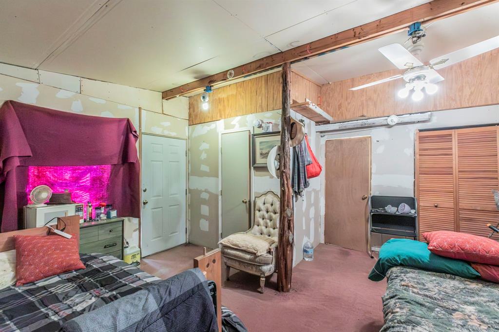 0 Private Road, Unit 4201 Clifton, TX 76634 - Photo 4 of 12 a bedroom with furniture and a chandelier