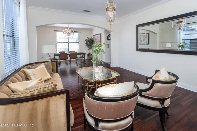 a kitchen with stainless steel appliances kitchen island granite countertop a stove and white cabinets