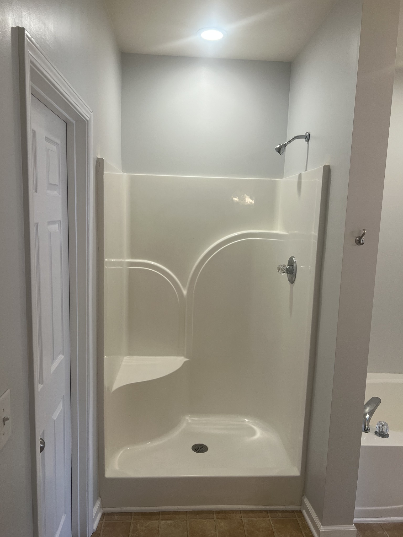 1019 Briggs Lane Spring Hill, TN 37174 - Photo 8 of 20 a bathroom with a glass shower door