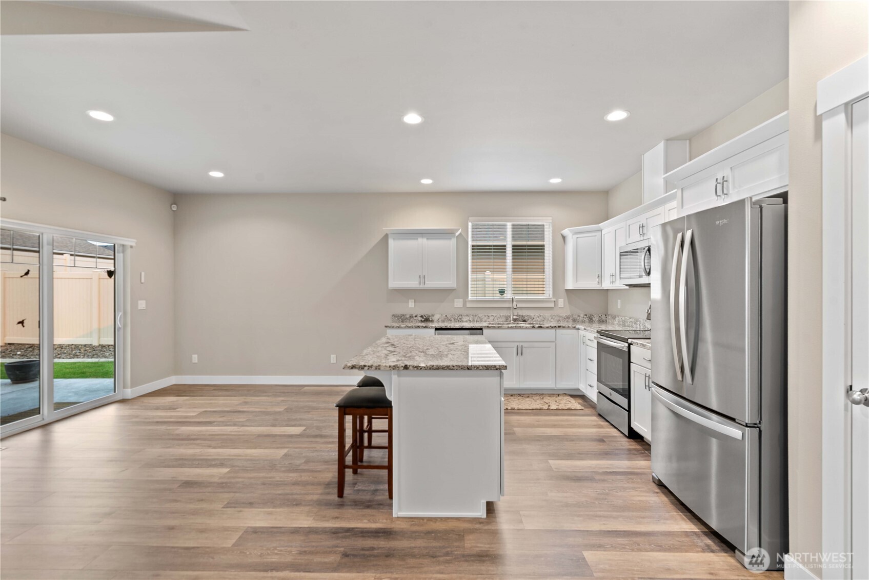 204 Pershing Circle Wenatchee, WA 98801 - Photo 13 of 33 a kitchen with stainless steel appliances kitchen island granite countertop a refrigerator and a stove top oven