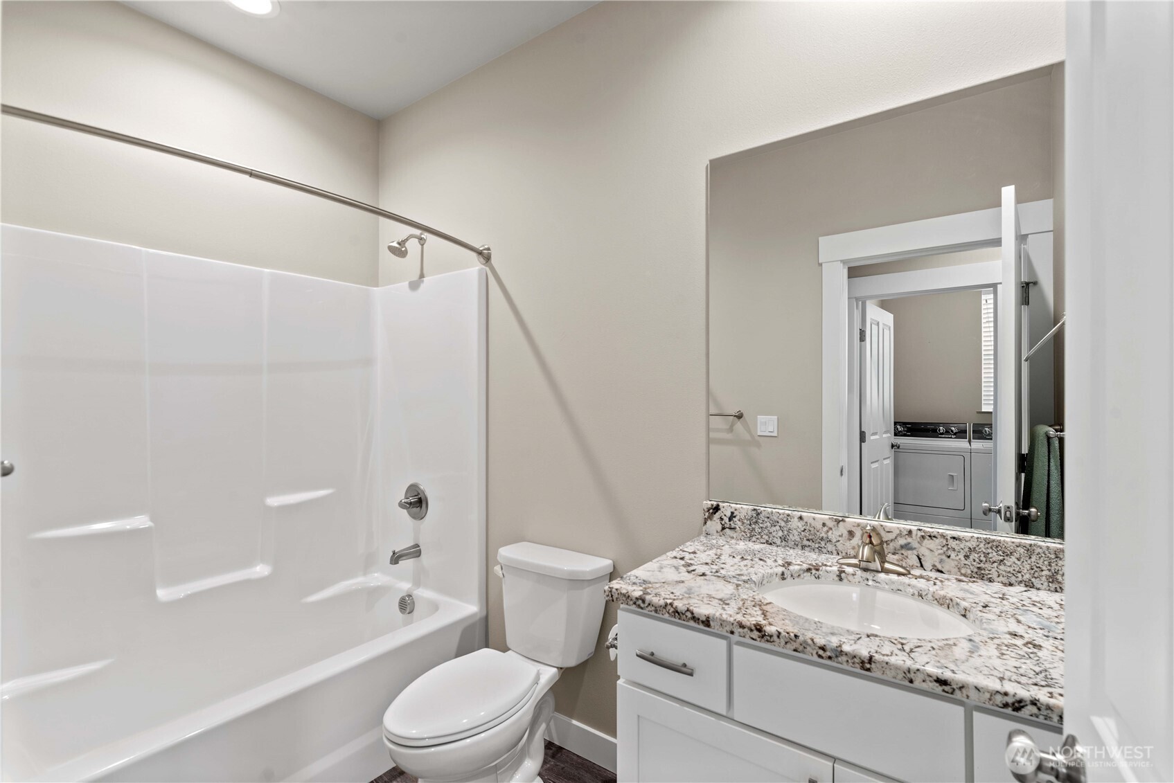 204 Pershing Circle Wenatchee, WA 98801 - Photo 16 of 33 a bathroom with a granite countertop sink a toilet and shower