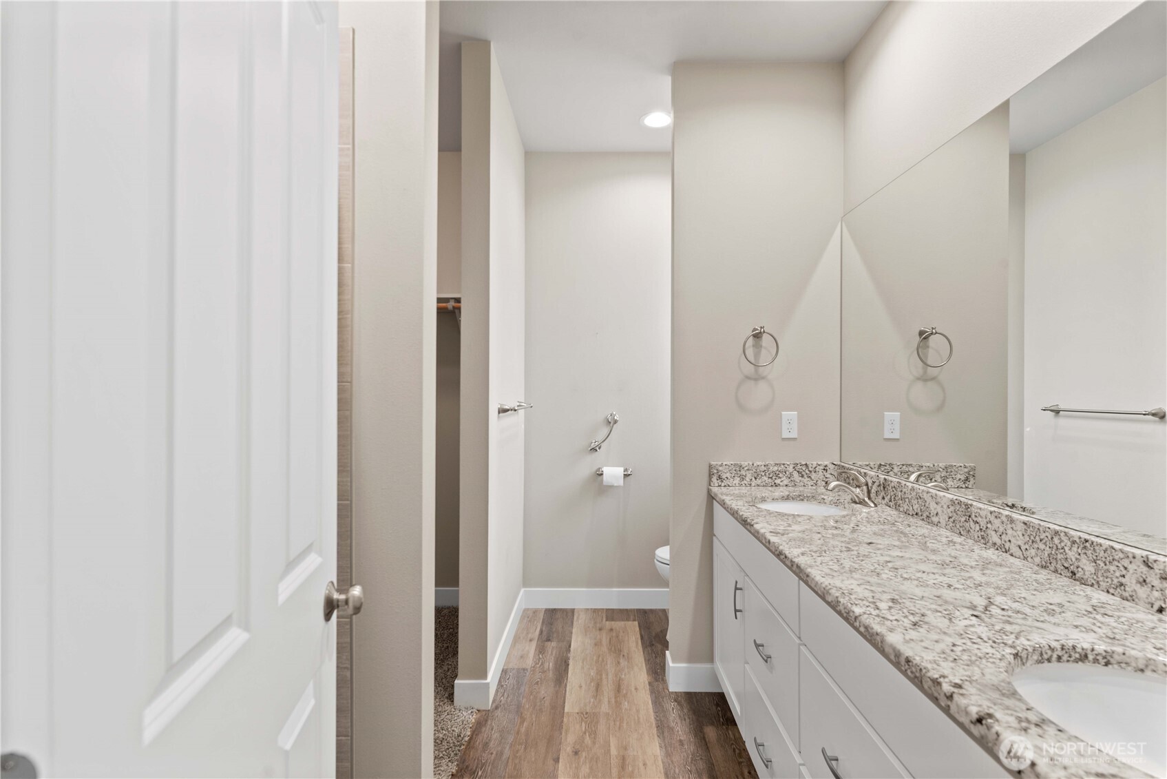 204 Pershing Circle Wenatchee, WA 98801 - Photo 22 of 33 a bathroom with a granite countertop sink a mirror and a shower