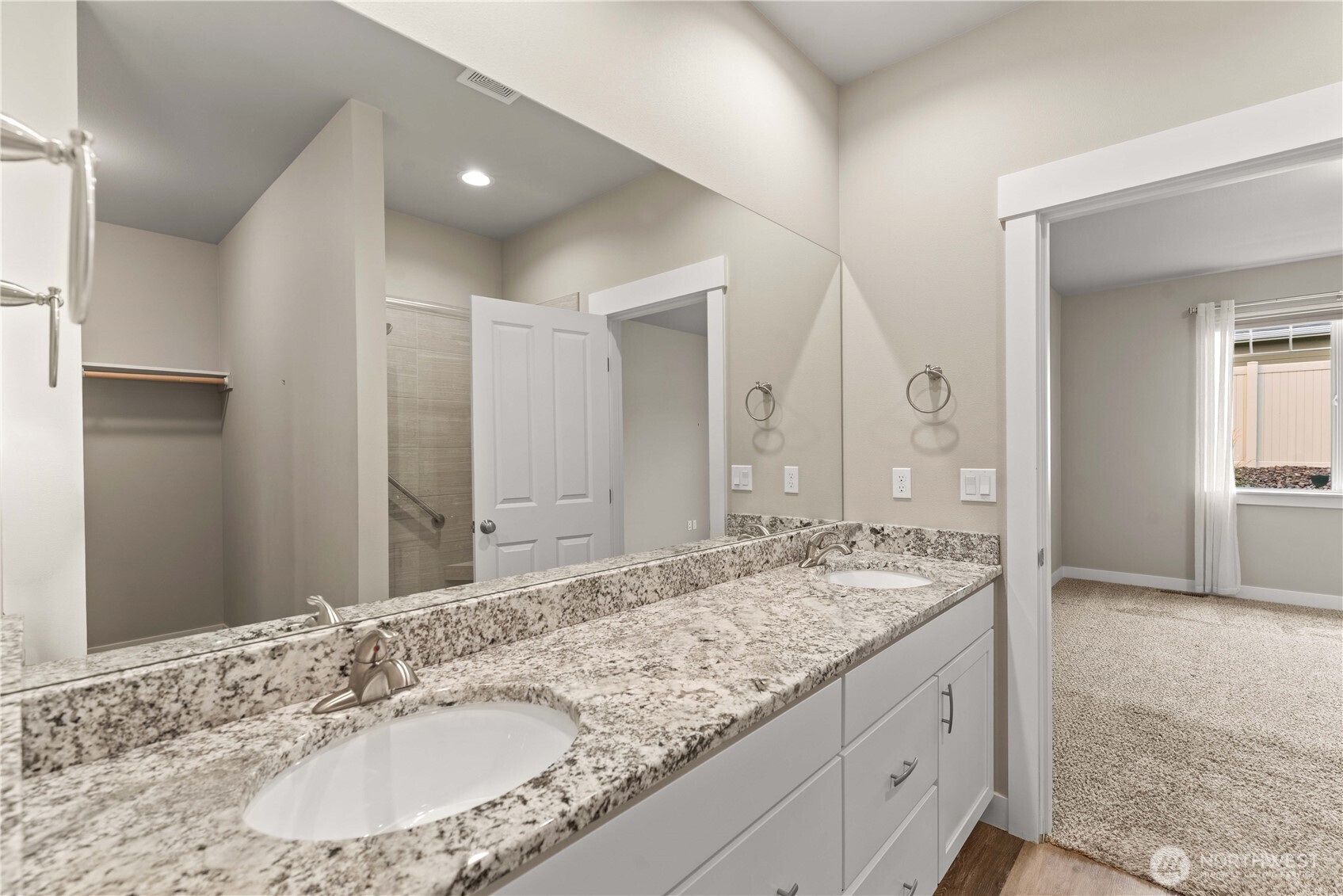 204 Pershing Circle Wenatchee, WA 98801 - Photo 23 of 33 a bathroom with a granite countertop double vanity sink and a mirror