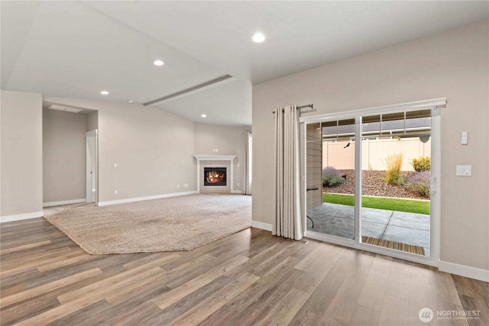 204 Pershing Circle Wenatchee, WA 98801 - Photo 7 of 33 a view of empty room with wooden floor and floor to ceiling window