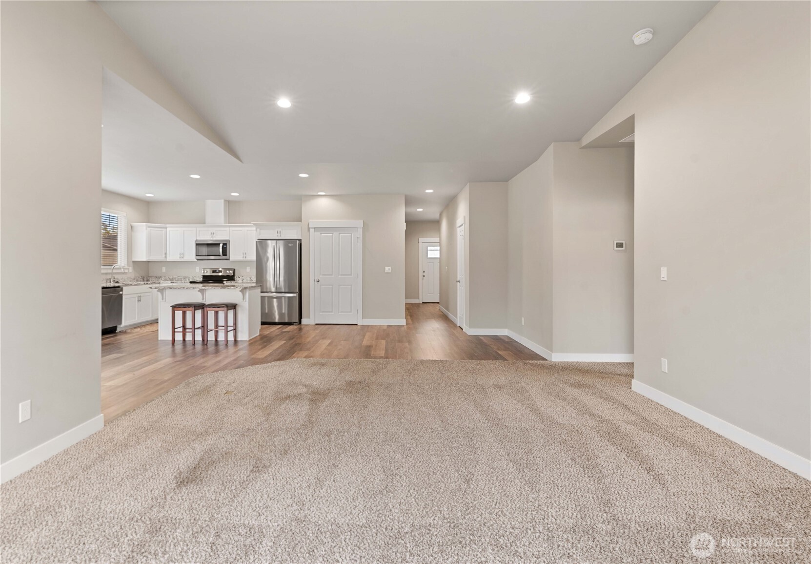 204 Pershing Circle Wenatchee, WA 98801 - Photo 8 of 33 a view of a kitchen with a refrigerator and a kitchen sink