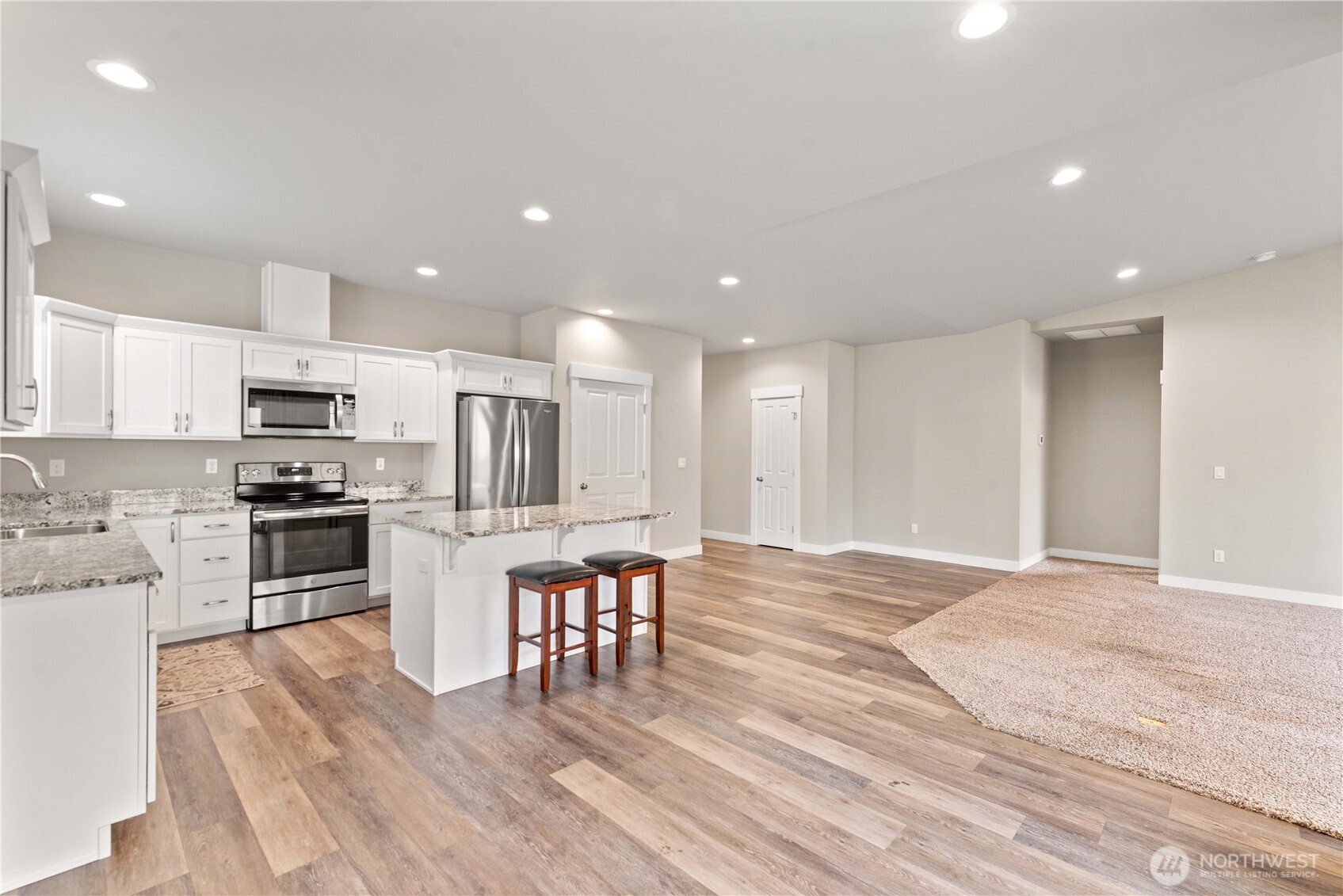 204 Pershing Circle Wenatchee, WA 98801 - Photo 9 of 33 a kitchen with stainless steel appliances a refrigerator and a stove top oven