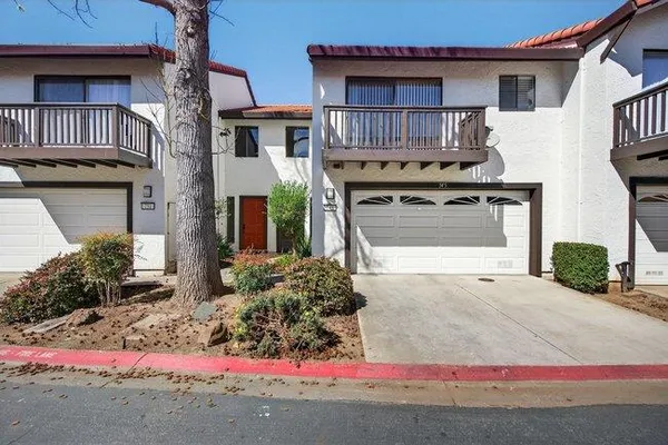 a front view of a house with garage