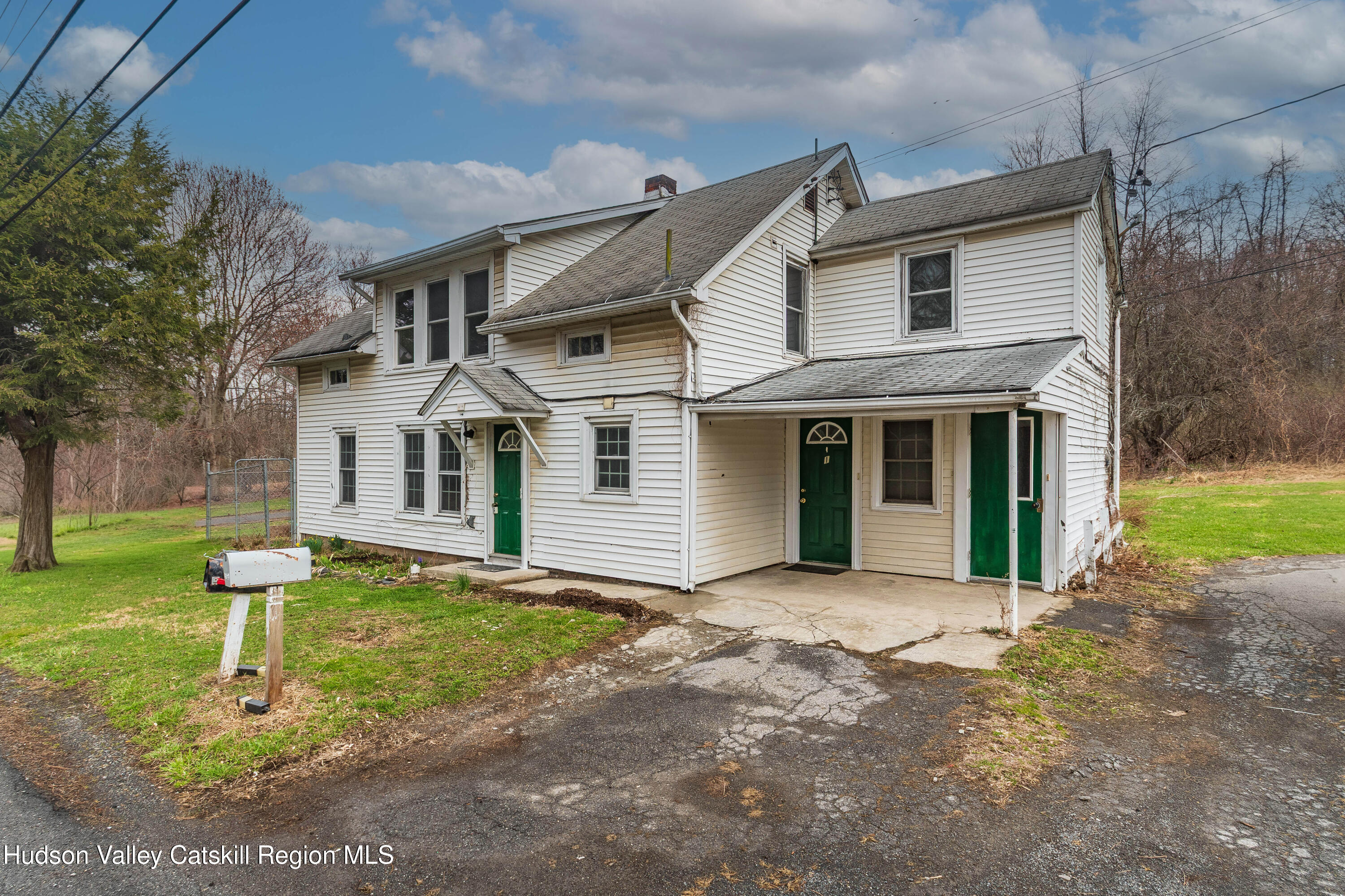 131 Station Road New Paltz, NY 12561 - Photo 1 of 31 a front view of a house with a yard