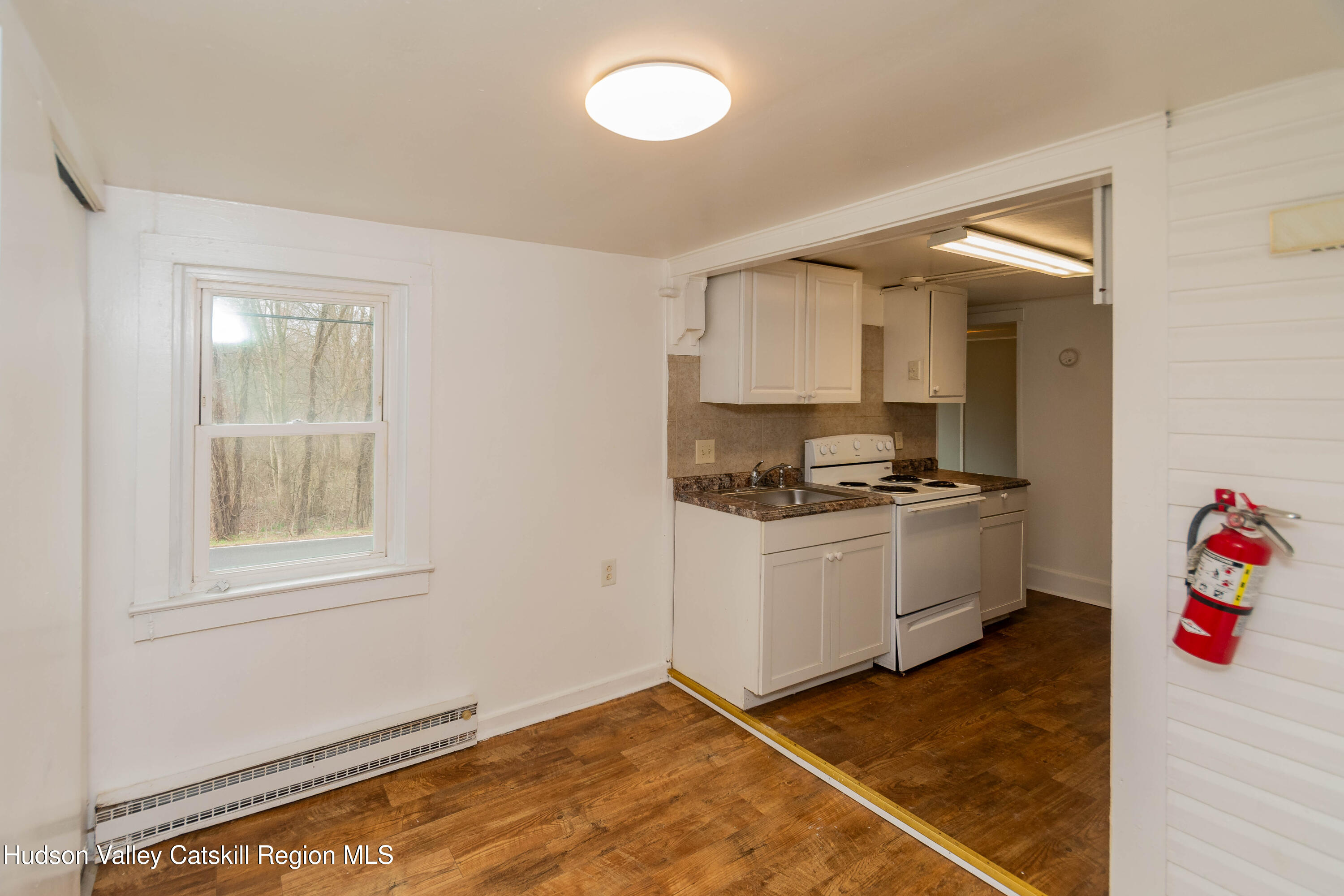131 Station Road New Paltz, NY 12561 - Photo 14 of 31 a kitchen with a refrigerator and window