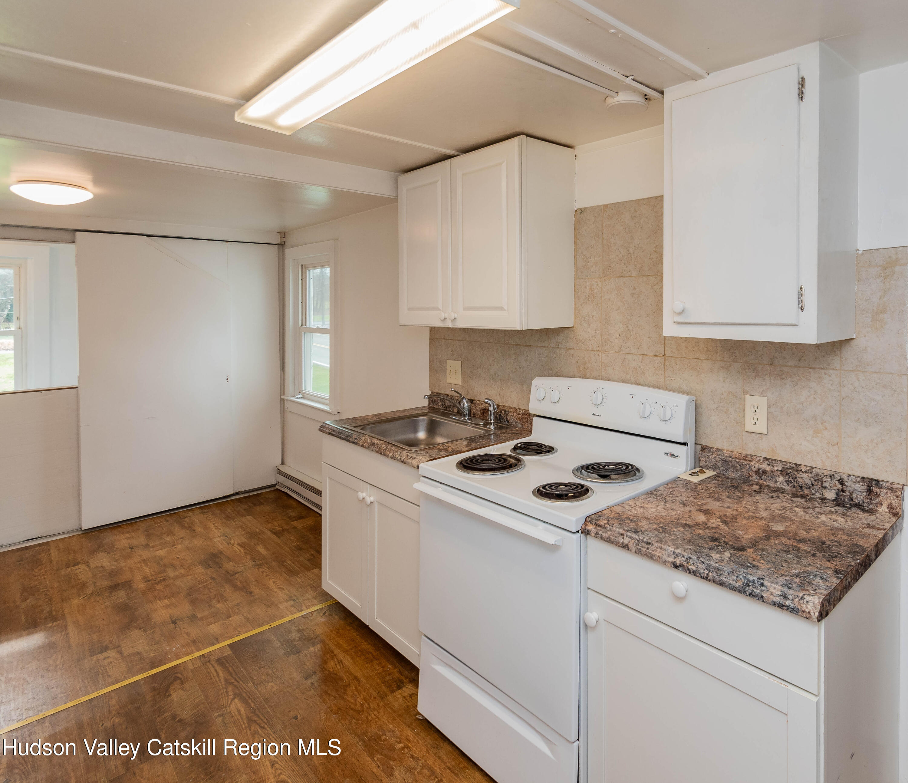 131 Station Road New Paltz, NY 12561 - Photo 16 of 31 a kitchen that has a sink and a stove
