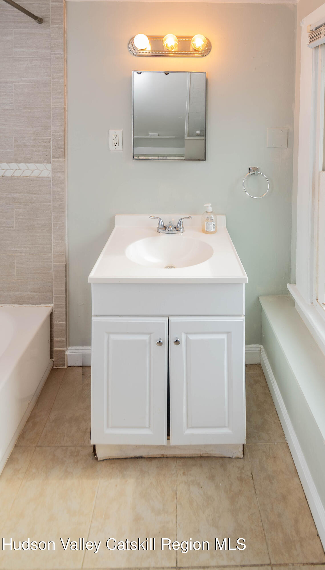 131 Station Road New Paltz, NY 12561 - Photo 23 of 31 a bathroom with a sink and a mirror