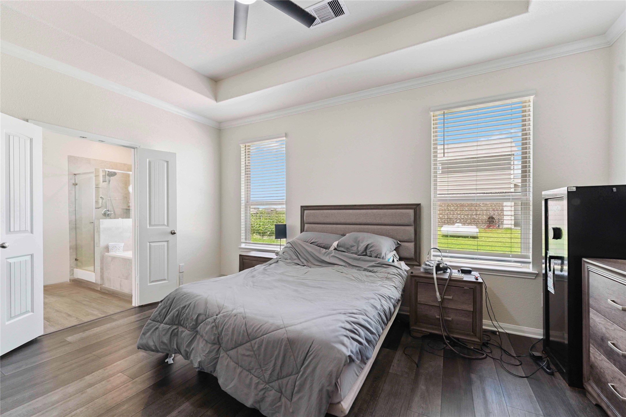 7718 Kovar Road Beasley, TX 77417 - Photo 13 of 30 a bedroom with a bed flat screen tv and window