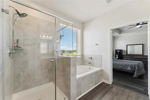 a bathroom with a bathtub and a shower