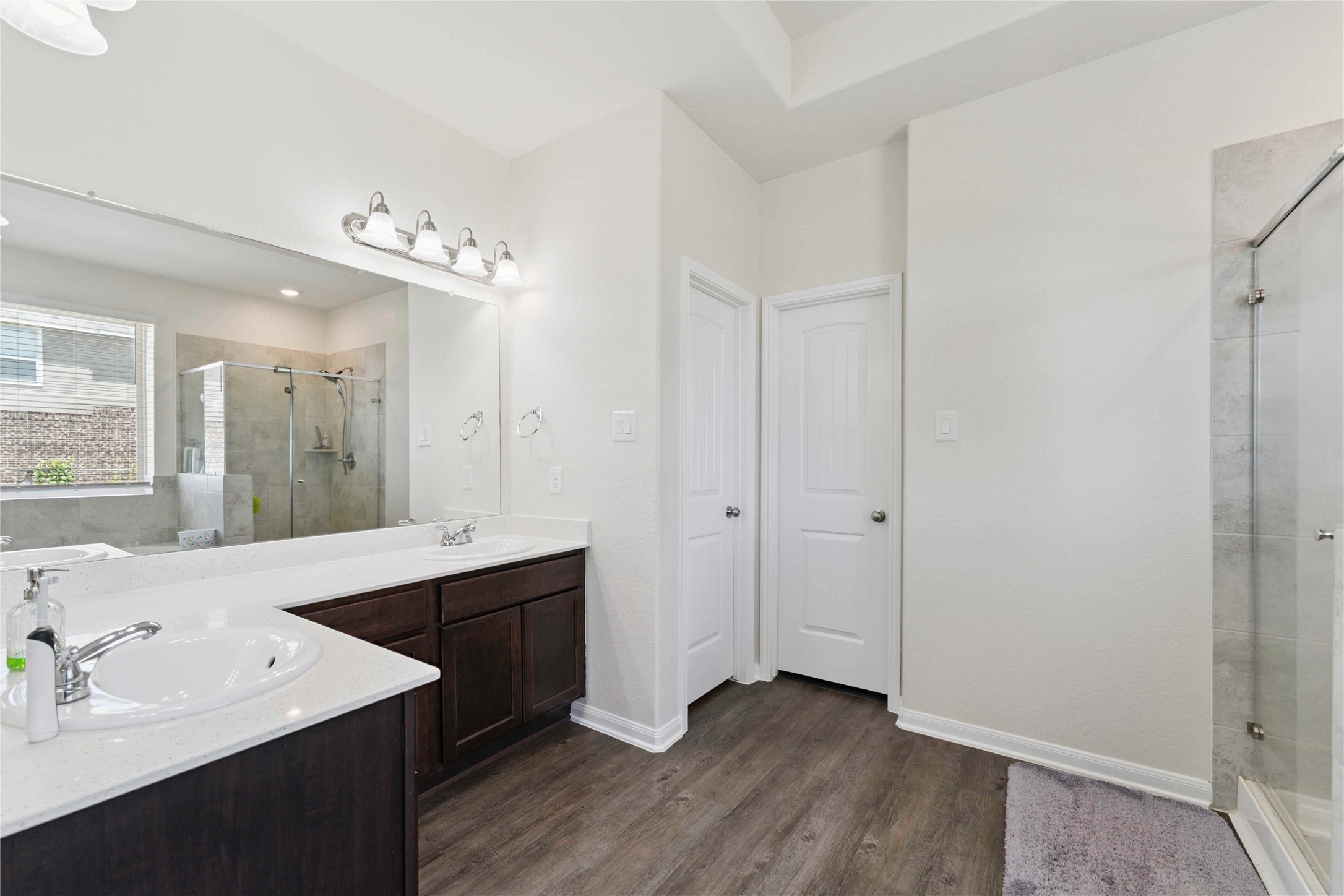 7718 Kovar Road Beasley, TX 77417 - Photo 15 of 30 a bathroom with a sink vanity granite tub and a mirror