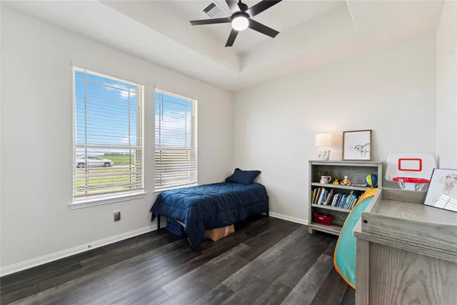 a living room with a bed furniture and a window