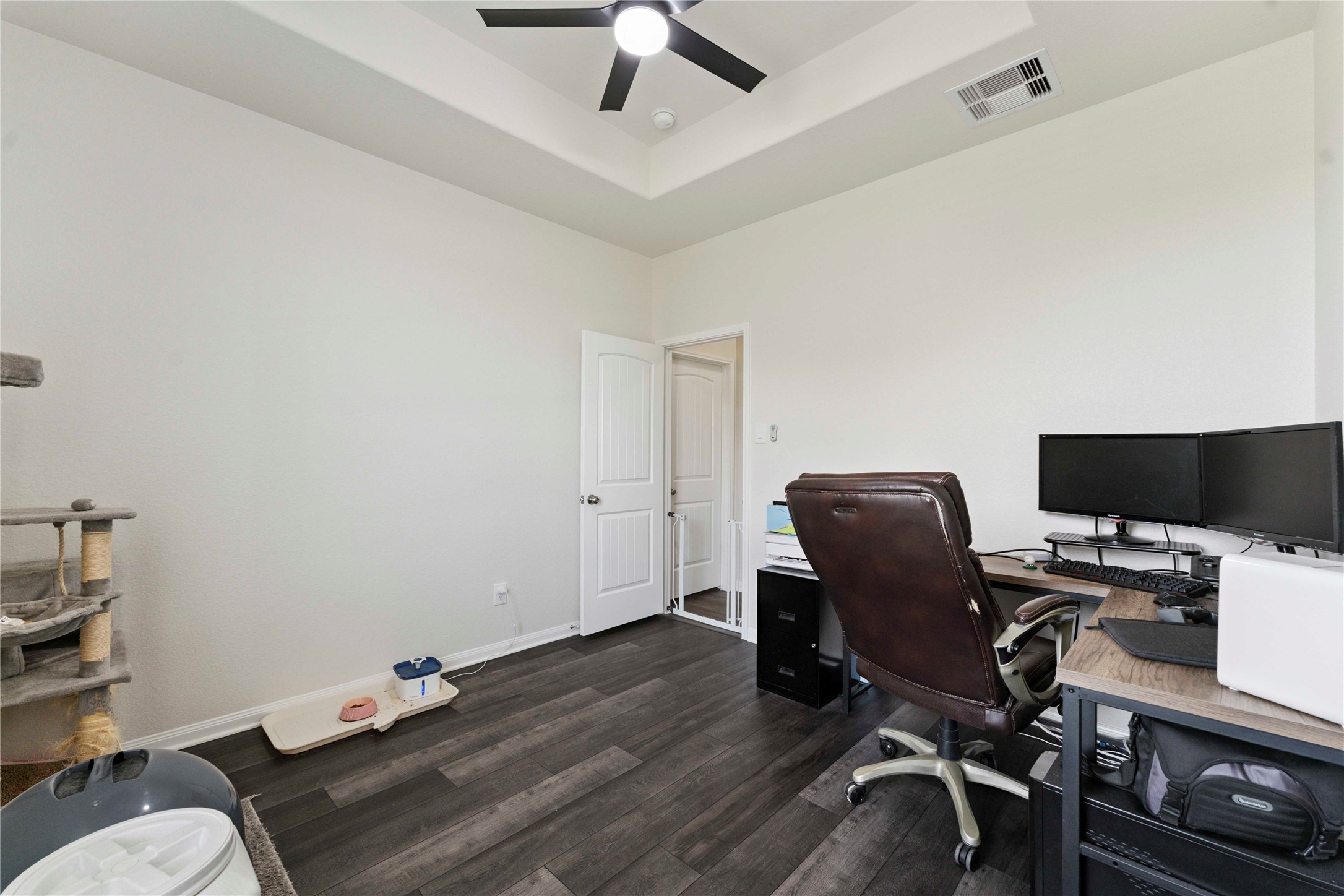 7718 Kovar Road Beasley, TX 77417 - Photo 20 of 30 a view of a workspace with furniture and wooden floor