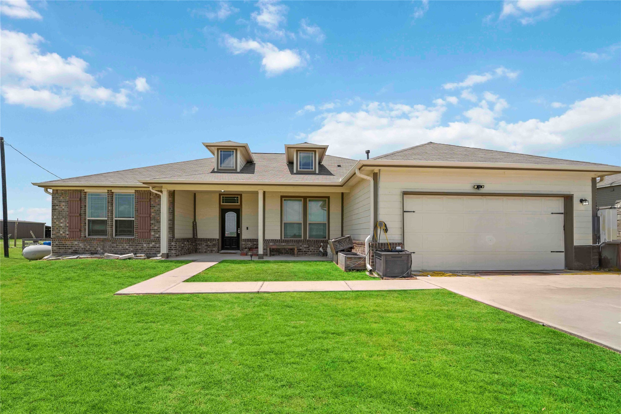 7718 Kovar Road Beasley, TX 77417 - Photo 2 of 30 a front view of a house with a yard and porch