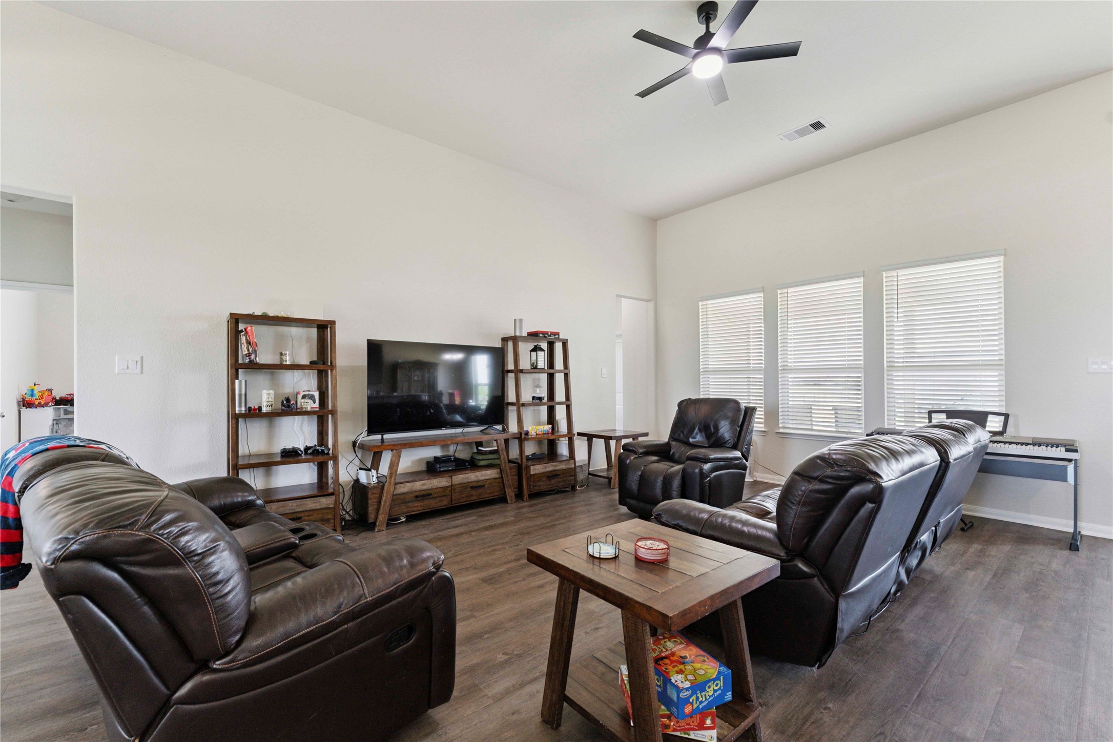 7718 Kovar Road Beasley, TX 77417 - Photo 6 of 30 a living room with furniture a flat screen tv and a large window
