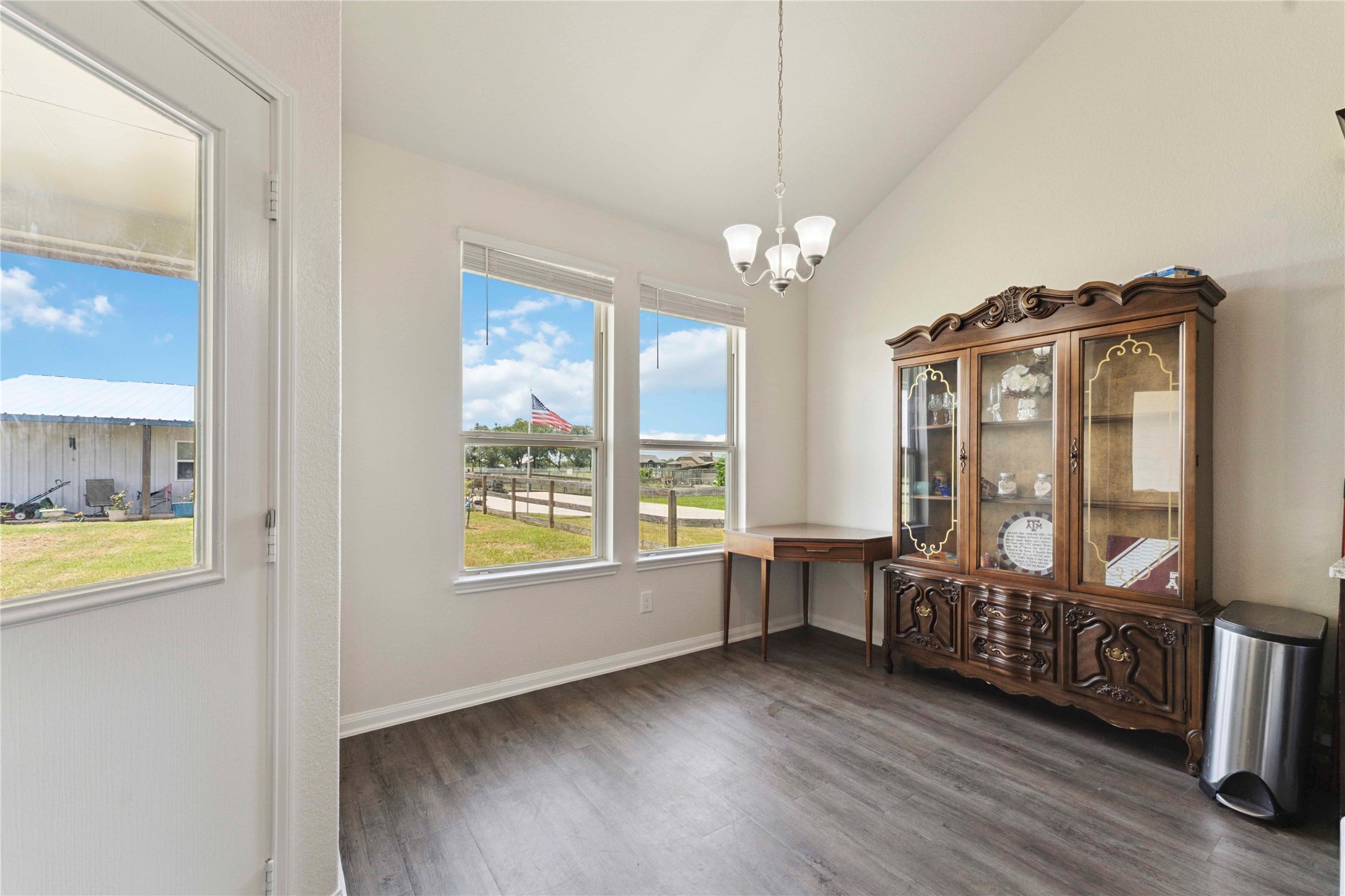 7718 Kovar Road Beasley, TX 77417 - Photo 10 of 30 a view of an empty room with window and wooden floor