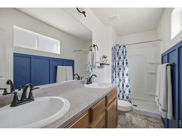 a kitchen with stainless steel appliances granite countertop a sink refrigerator and cabinets