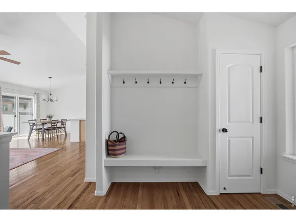 a view of kitchen with furniture and wooden floor