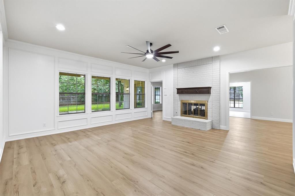 19 Timbergreen Circle Denton, TX 76205 - Photo 6 of 40 a view of an empty room with a fireplace and a window