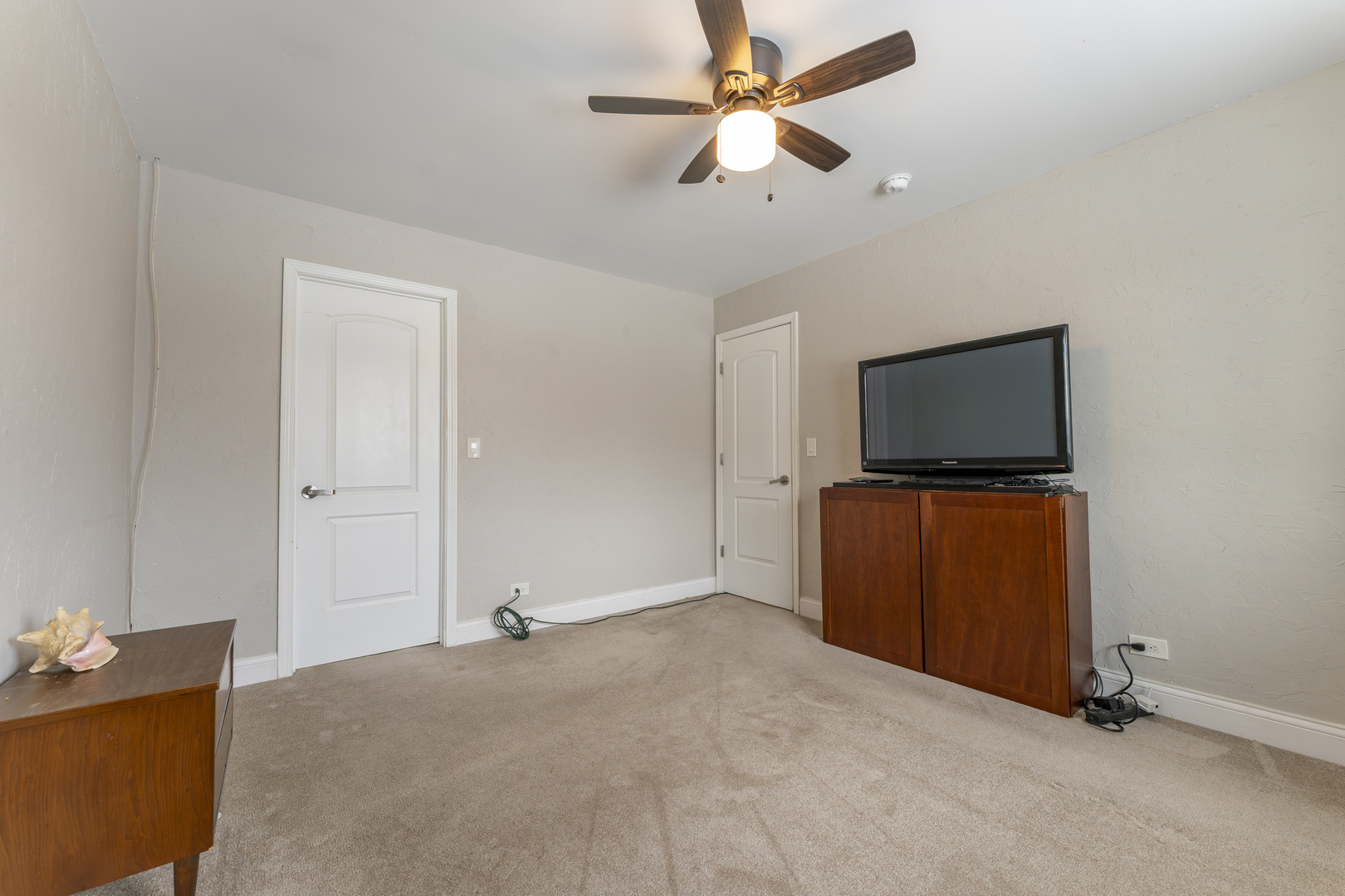 513 Jill Lane Bolingbrook, IL 60440 - Photo 12 of 20 a living room with furniture and a flat screen tv