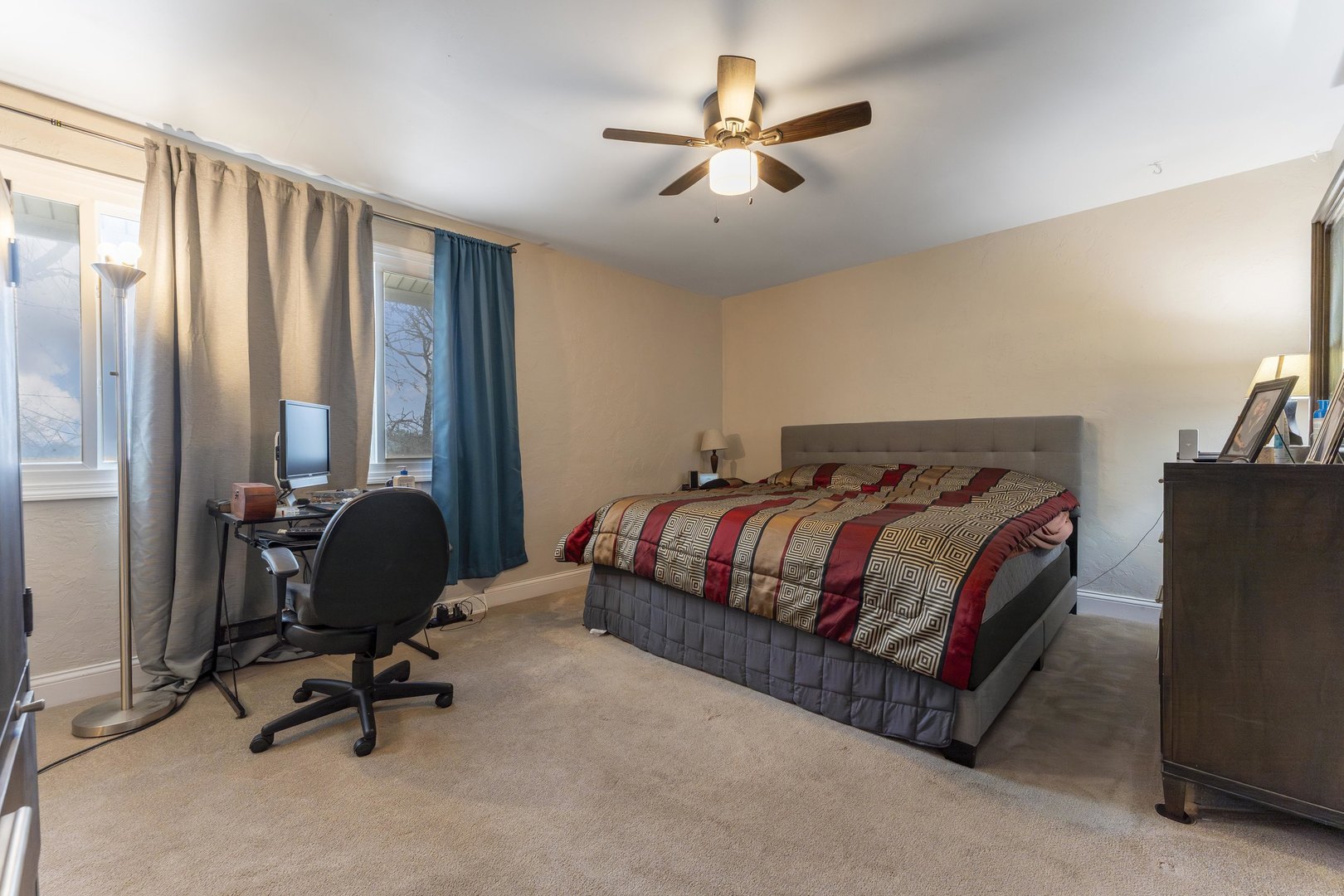 513 Jill Lane Bolingbrook, IL 60440 - Photo 14 of 20 a bedroom with a large bed and a chandelier