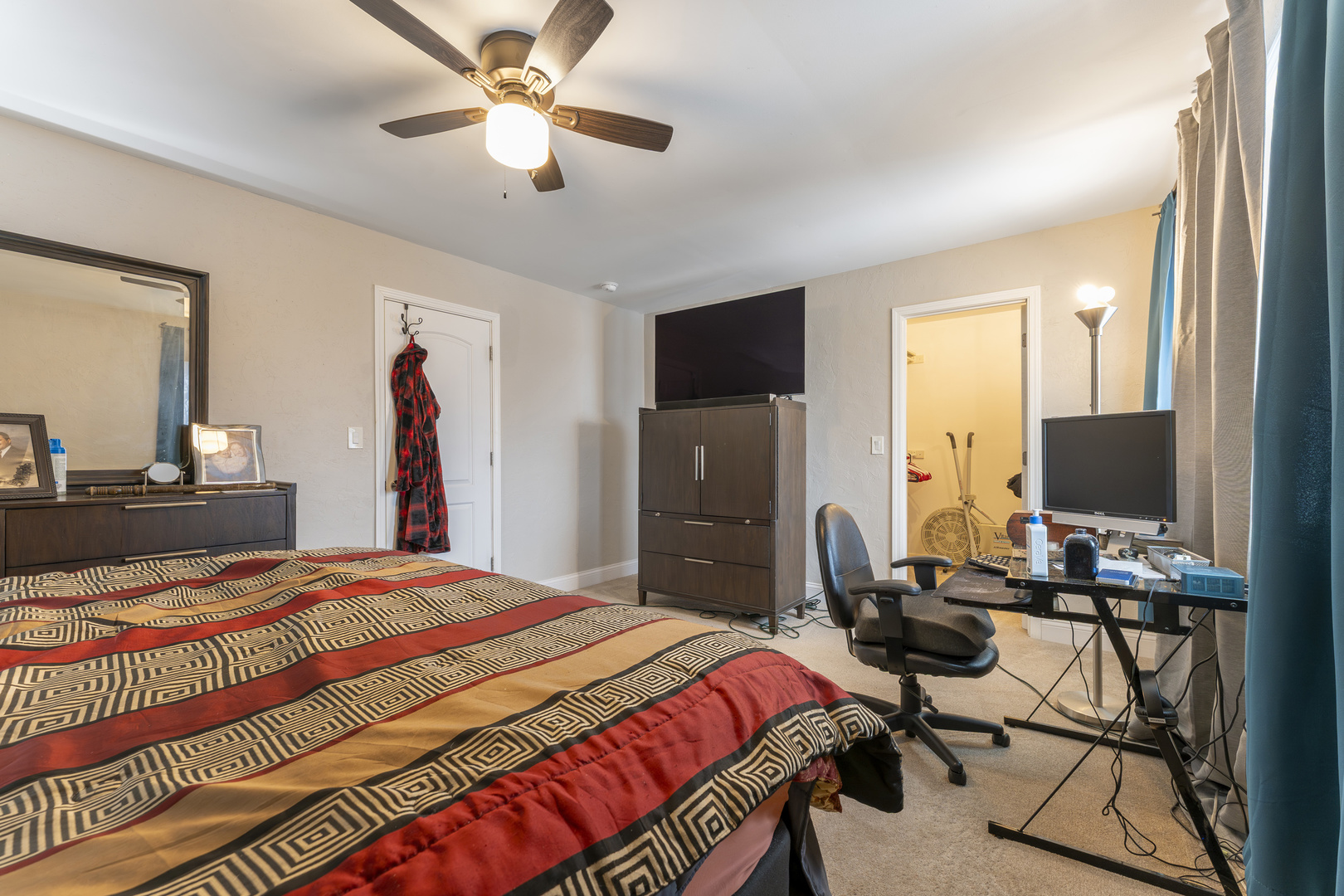 513 Jill Lane Bolingbrook, IL 60440 - Photo 16 of 20 a bedroom with a bed and a flat screen tv