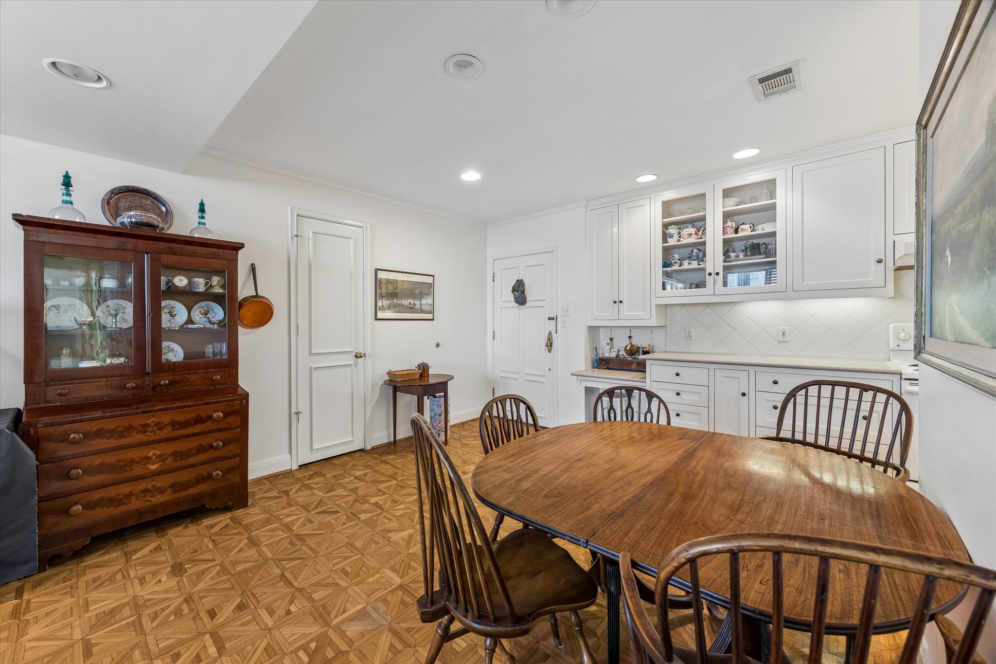 1801 Lavaca Street, Unit 6E Austin, TX 78701 - Photo 7 of 32 Dining room with parquet floors, recessed lighting, and crown molding