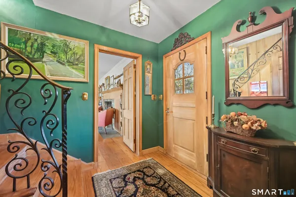 a front door with furniture and a window