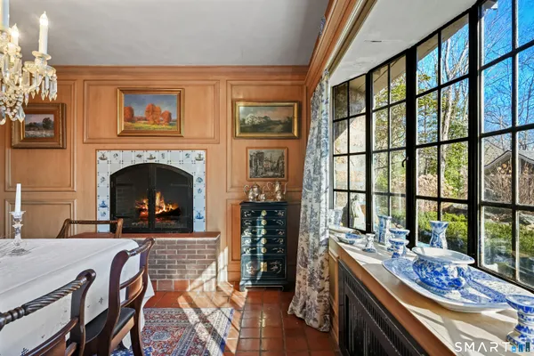 a living room with furniture fireplace and flat screen tv