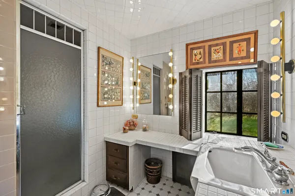 a bathroom with a sink and a window