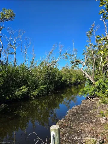 a view of lake with green space