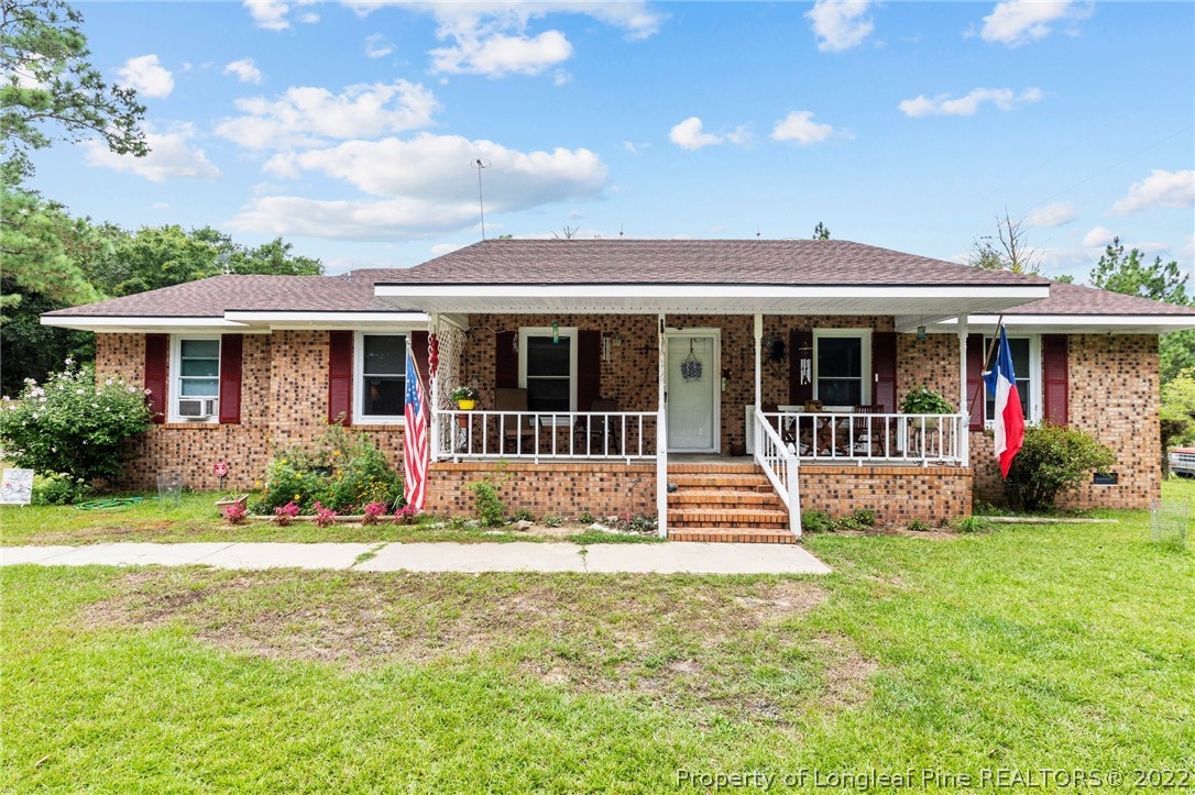15921 Palmer Road Marston, NC 28363 - Photo 1 of 39 a front view of a house with a yard