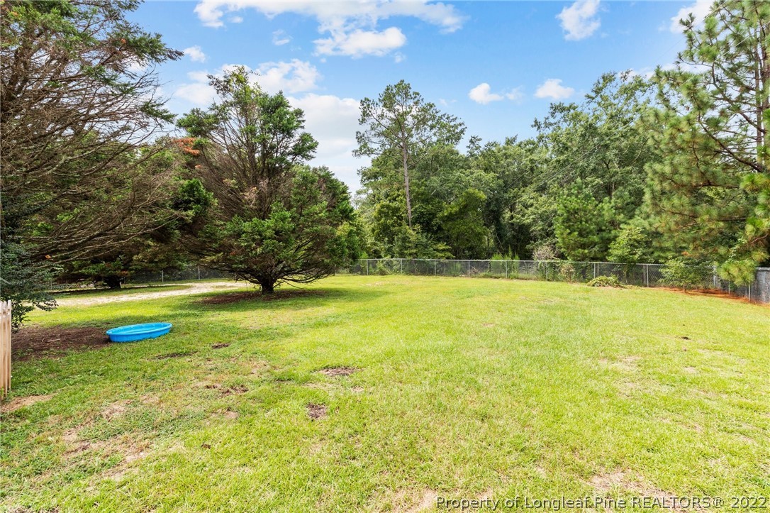 15921 Palmer Road Marston, NC 28363 - Photo 18 of 39 a view of a swimming pool with an outdoor space and seating area