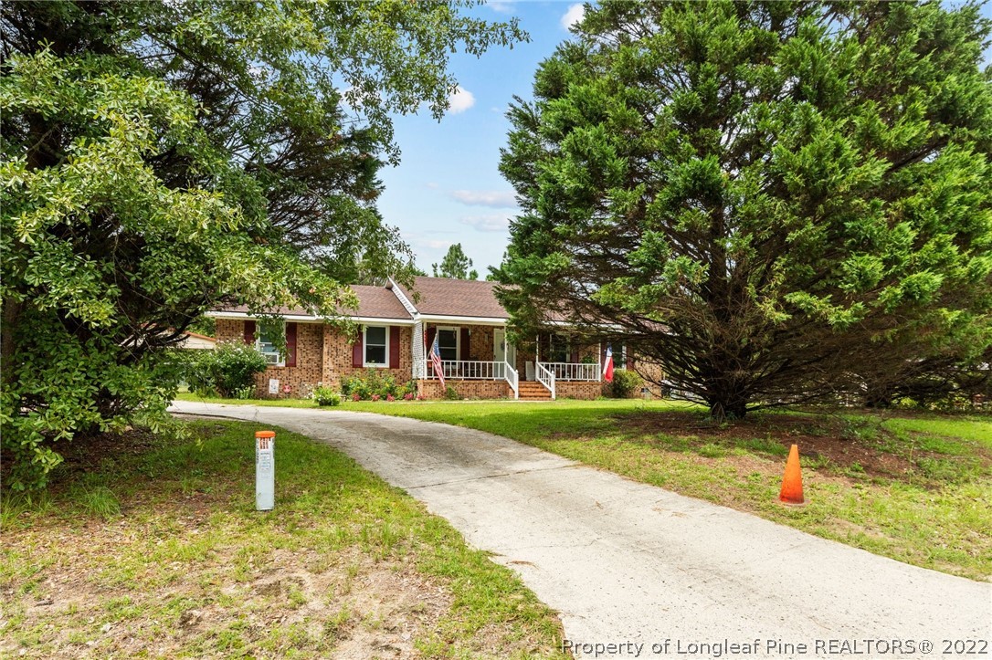 15921 Palmer Road Marston, NC 28363 - Photo 20 of 39 a front view of a house with garden