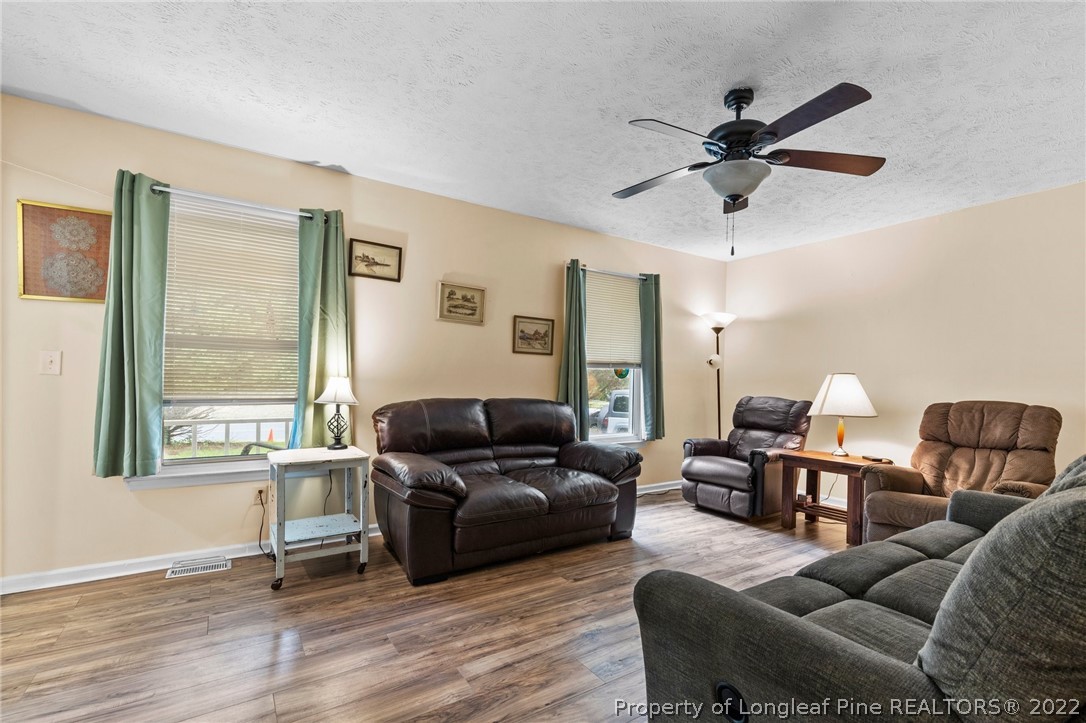 15921 Palmer Road Marston, NC 28363 - Photo 22 of 39 a living room with furniture and a window