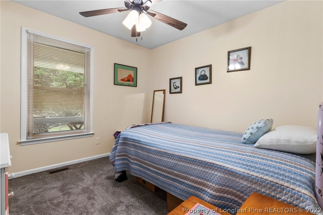 15921 Palmer Road Marston, NC 28363 - Photo 24 of 39 a bedroom with a bed and a window