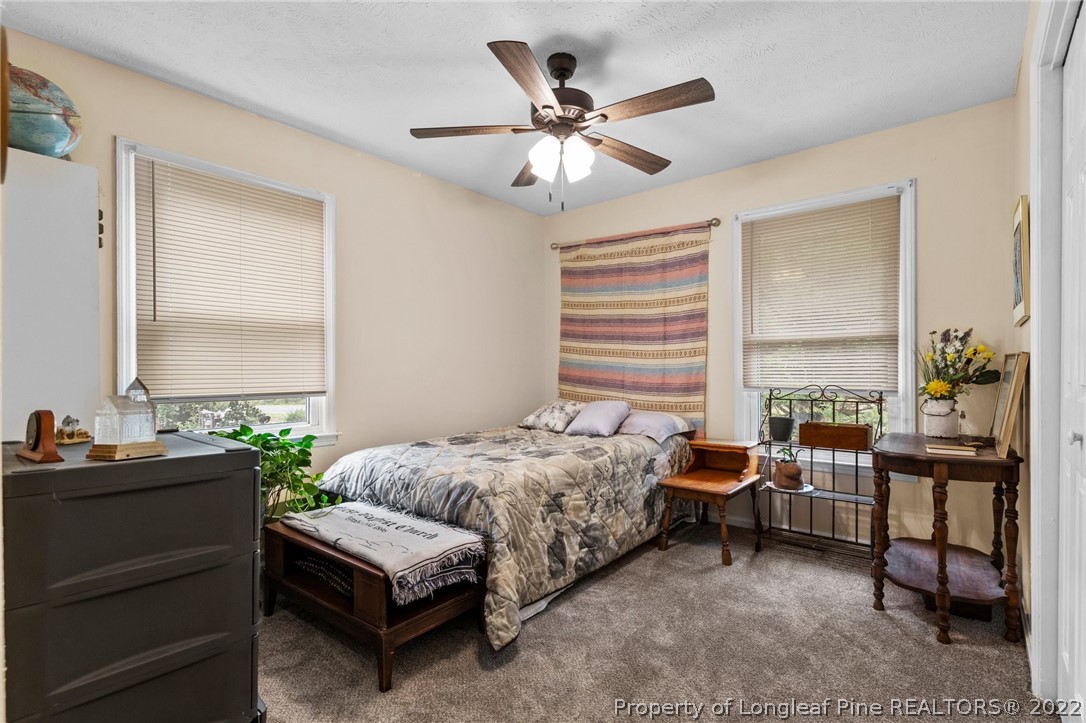 15921 Palmer Road Marston, NC 28363 - Photo 25 of 39 a bedroom with a bed and a window