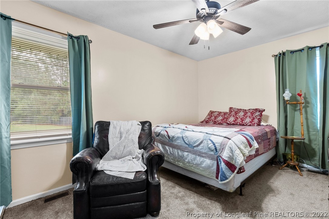 15921 Palmer Road Marston, NC 28363 - Photo 26 of 39 a bedroom with a bed and window