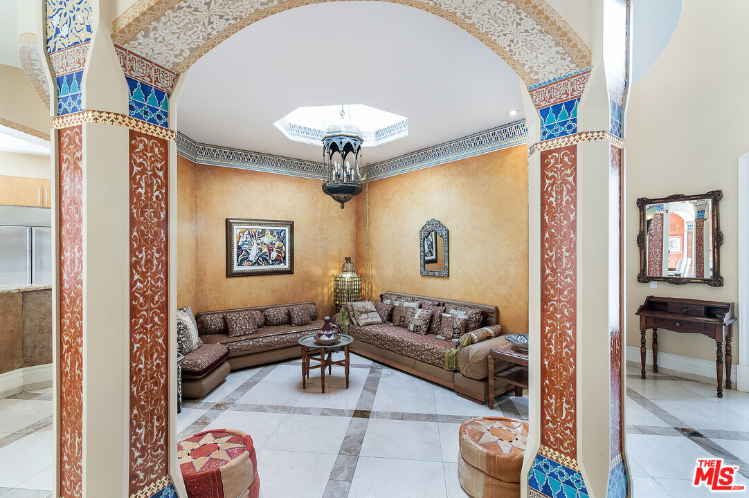 3002 Hutton Place Beverly Hills, CA 90210 - Photo 6 of 9 a living room with furniture and a chandelier