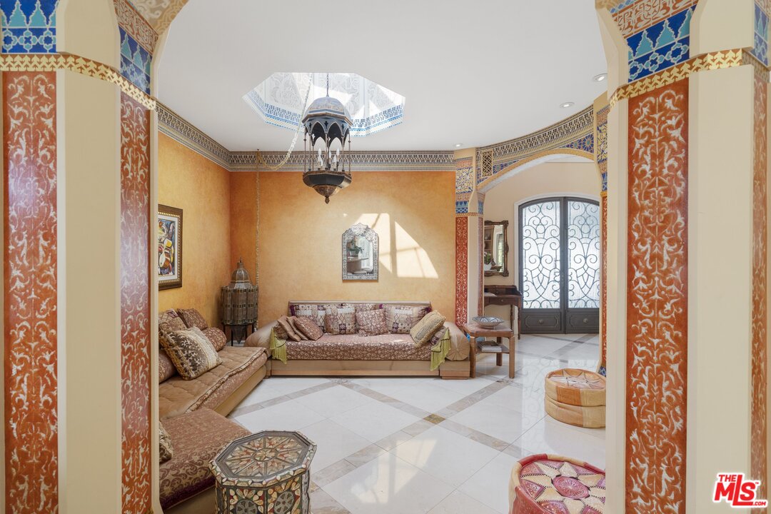 3002 Hutton Place Beverly Hills, CA 90210 - Photo 9 of 9 a living room with furniture and a chandelier